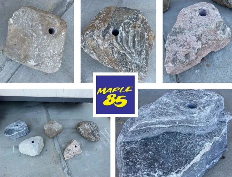 boulders with bubbler holes drilled and a maple 85 logo